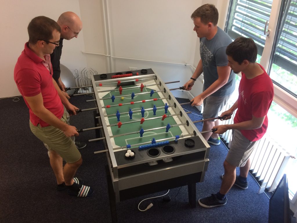 insign team playing table soccer